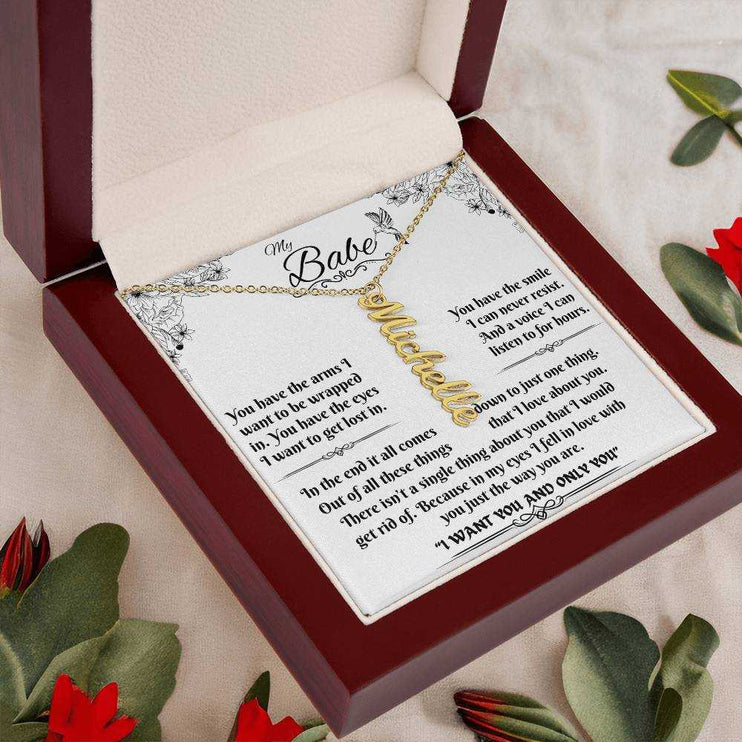 yellow gold vertical name necklace in a luxury box angled left