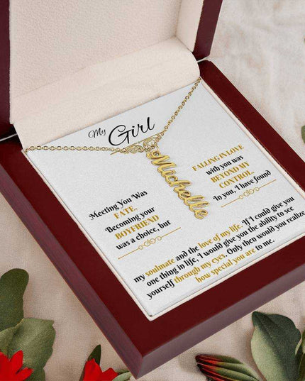 gold vertical name necklace in luxury box angled left