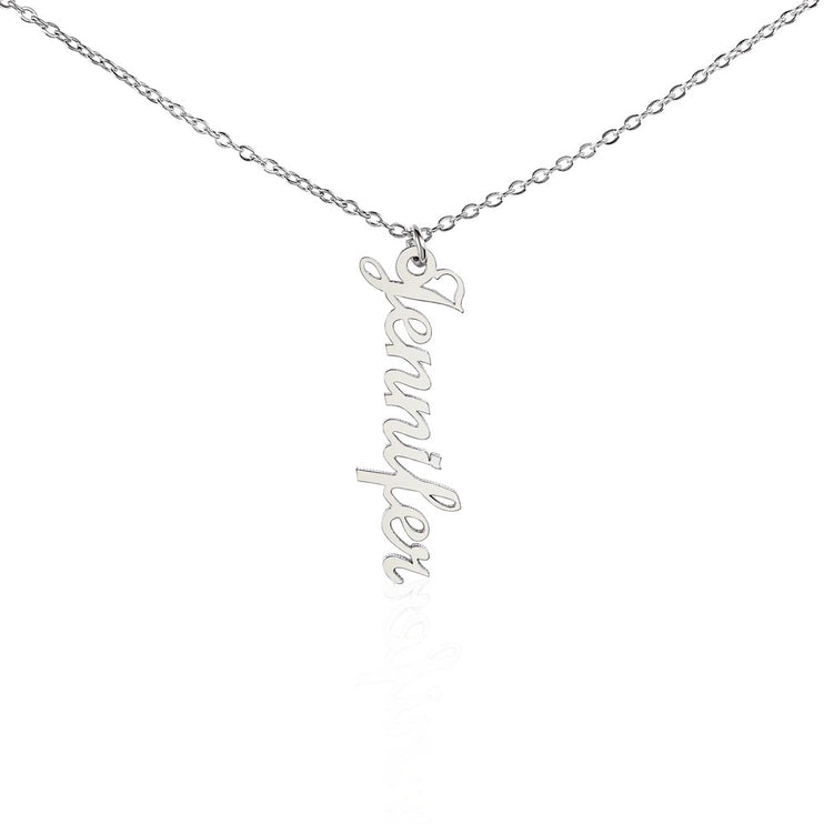 a polished stainless steel vertical name necklace hanging