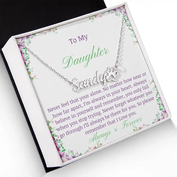 A polished stainless-steel pet name paw print necklace angled left