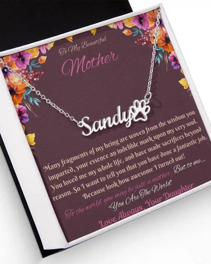 polished steel paw print pet name necklace in soft box angled left