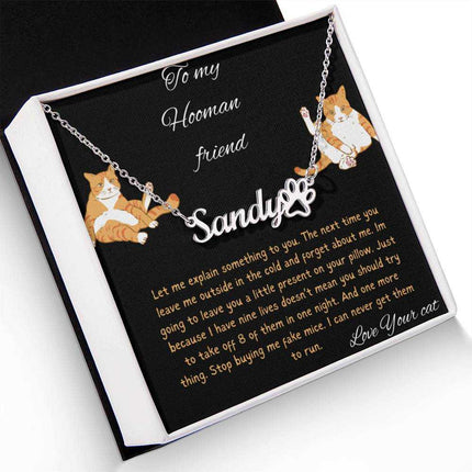 Pet Name Paw Print Necklace with a polished stainless-steel variant on a to my hooman greeting card inside a two-tone box angled slightly to the left with a up close view