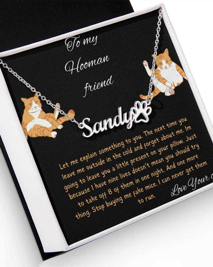 Pet Name Paw Print Necklace with a polished stainless-steel variant on a to my hooman greeting card inside a two-tone box angled slightly to the left with a up close view