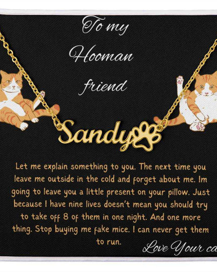 Pet Name Paw Print Necklace with a yellow gold finish variant on a to my hooman greeting card with a up close view
