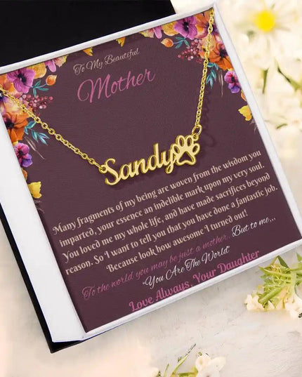 gold paw print pet name necklace in soft box angled left