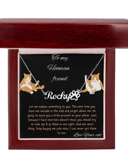 Pet Name Paw Print Necklace with a polished stainless-steel variant on a to my hooman greeting card inside a mahogany box with a up close view