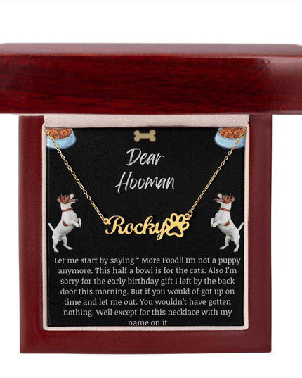 Pet Name Paw Print Necklace with a yellow gold variant on a Dear Human greeting card inside a mahogany box with up close view