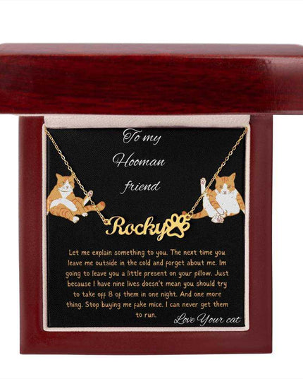 Pet Name Paw Print Necklace with a yellow gold finish variant on a to my hooman greeting card inside of a mahogany box with a up close view