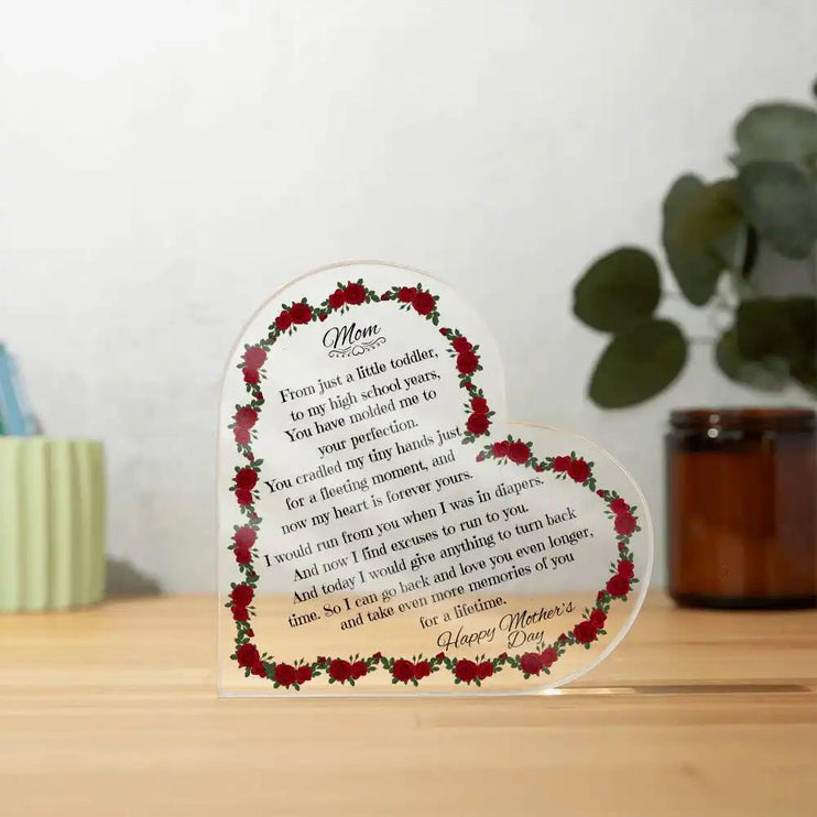 a printed acrylic heart on a table
