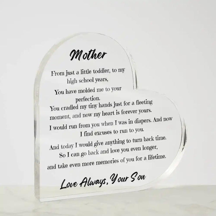 a acrylic heart plaque on a table with a angle to left