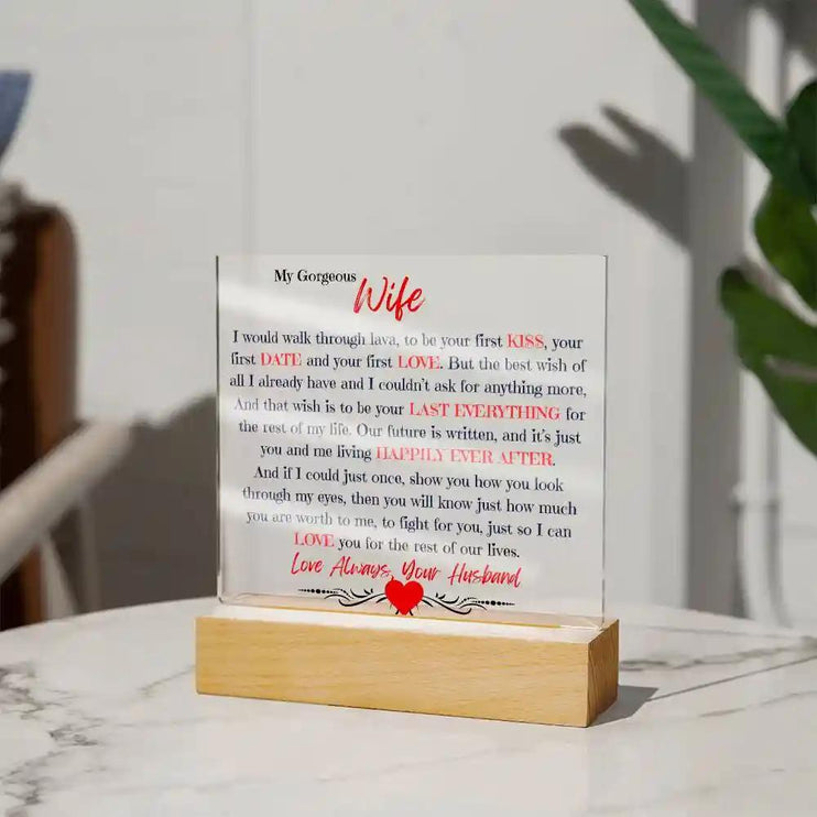 Acrylic Square Plaque with wood base on a white table far away view.