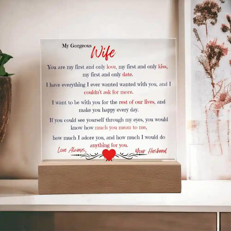 A acrylic square plaque with on a shelf with heartfelt message