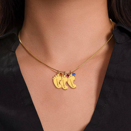 Engraved Baby Feet Charm Necklace with 3 yellow gold finish charm on model