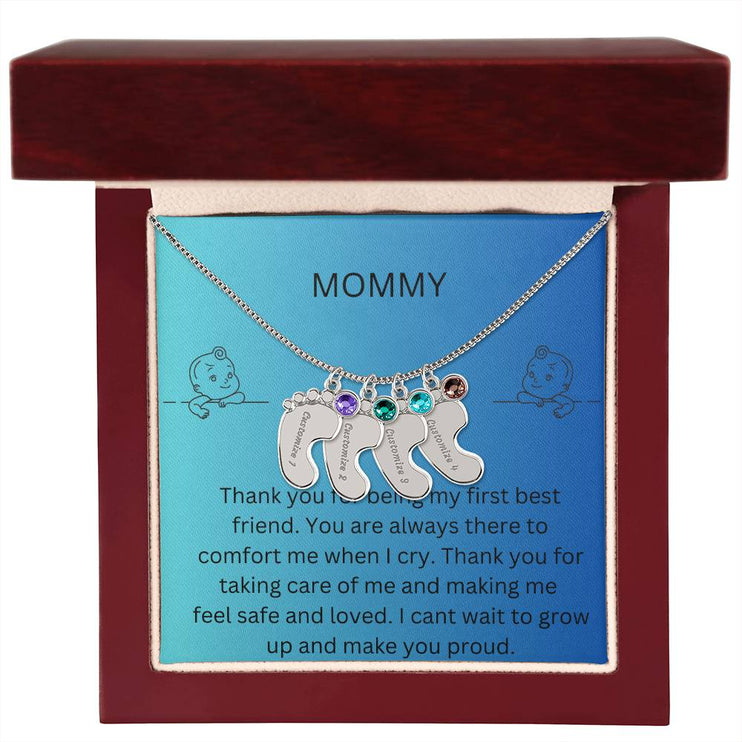 a 4 charm polished silver baby feet birthstone necklace in a mahogany box