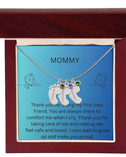 a 3 charm polished silver baby feet birthstone necklace in a mahogany box