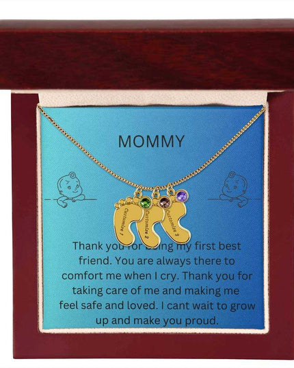 a 3 charm yellow gold baby feet birthstone necklace in a mahogany box