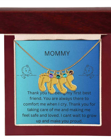 a 4 charm yellow gold baby feet birthstone necklace in a mahogany box