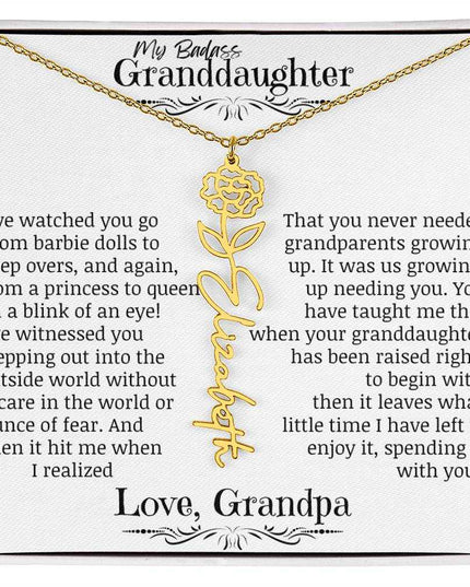 a yellow gold flower name necklace.