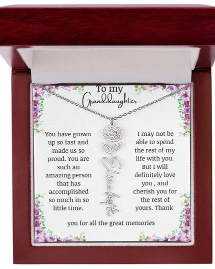a polished stainless-steel January birth flower name necklace in a mahogany bo.