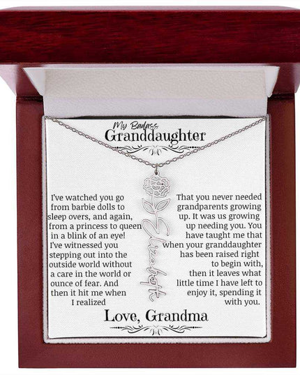 a polished stainless steel flower name necklace for January in mahogany box.