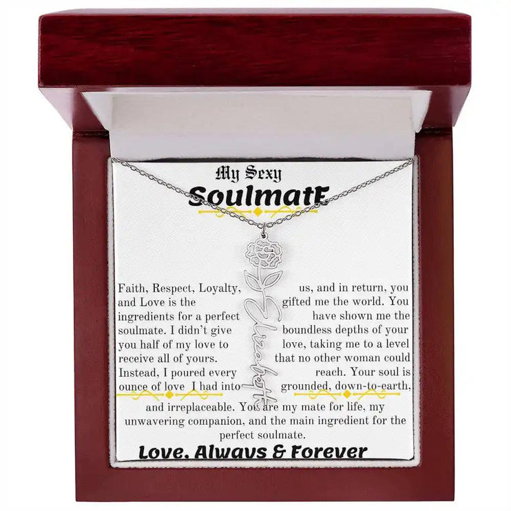 a birth flower name necklace in polished stainless steel for January in a mahogany box.