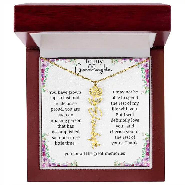 a yellow gold finish January birth flower name necklace in a mahogany box.