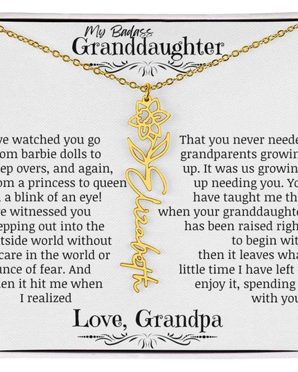 a yellow gold flower name necklace.