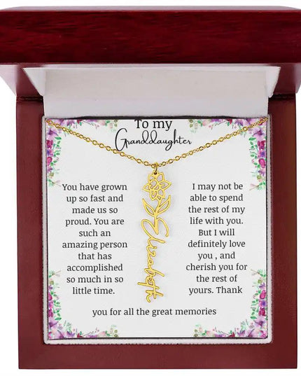 a yellow gold finish March birth flower name necklace in a mahogany box.