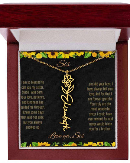 Birth Flower Name Necklace with a yellow gold variant of a flower on a To Sis from Sis message card in a mahogany box up close