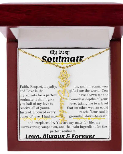a birth flower name necklace in yellow gold for March in a mahogany box.