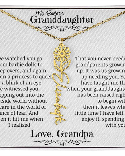 a yellow gold flower name necklace.
