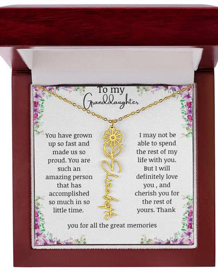a yellow gold finish April birth flower name necklace in a mahogany box.