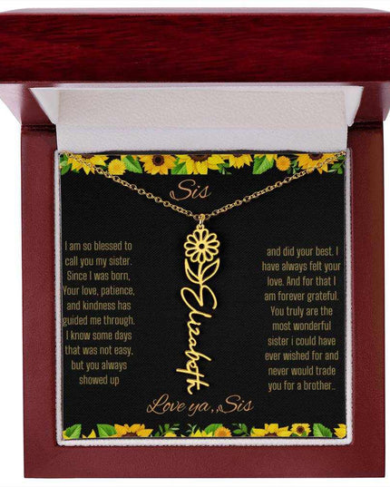 Birth Flower Name Necklace with a yellow gold variant of a flower on a To Sis from Sis message card in a mahogany box up close
