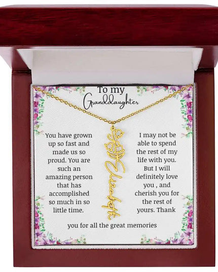 a yellow gold finish May birth flower name necklace in a mahogany box.