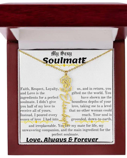 a birth flower name necklace in yellow gold for June in a mahogany box.