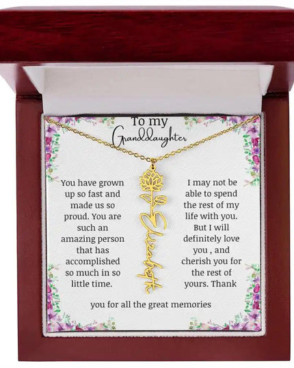 a yellow gold finish July birth flower name necklace in a mahogany box.