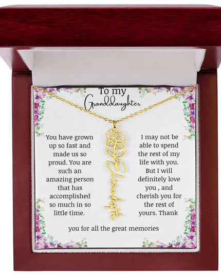 a yellow gold finish August birth flower name necklace in a mahogany box.
