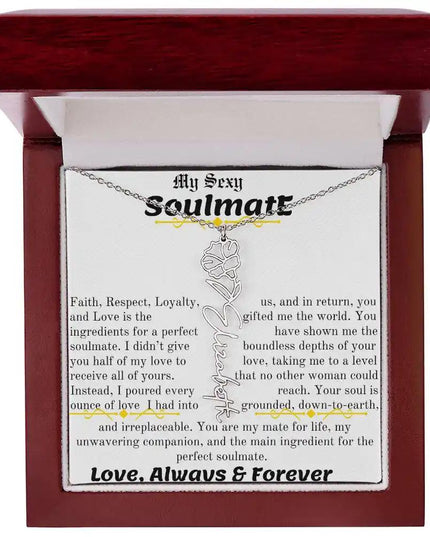 a birth flower name necklace in polished stainless steel for September in a mahogany box.