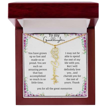 a yellow gold finish September birth flower name necklace in a mahogany box.