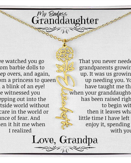 a yellow gold flower name necklace.