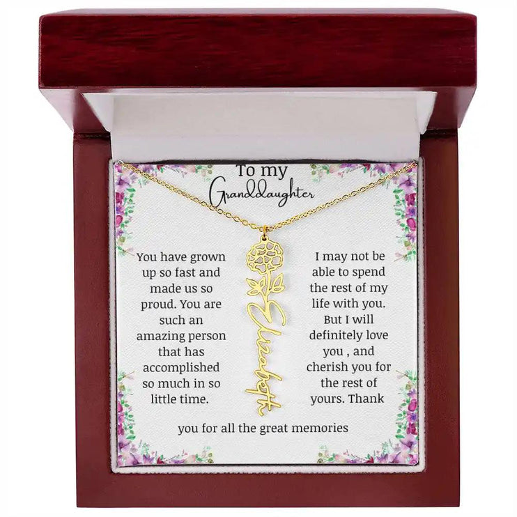 a yellow gold finish October birth flower name necklace in a mahogany box.