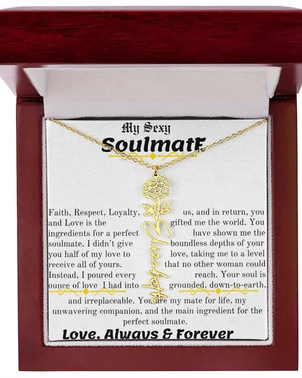 a birth flower name necklace in yellow gold for October in a mahogany box.