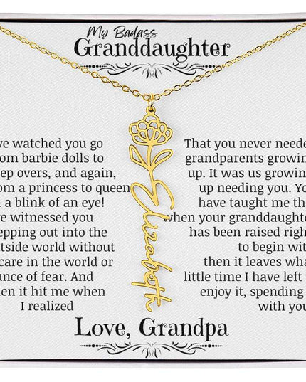 a yellow gold flower name necklace.