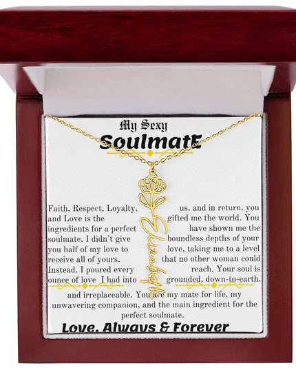 a birth flower name necklace in yellow gold for November in a mahogany box.