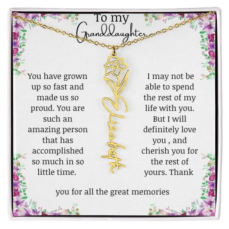 a yellow gold finish December birth flower name necklace.