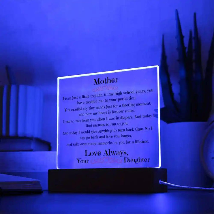 a acrylic square plaque up close with the blue LED light on