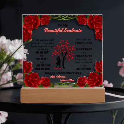 120v acrylic square plaque on a black table