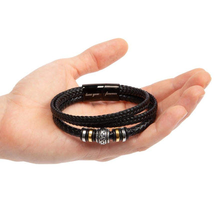 love you forever bracelet in the palm of a model's hand