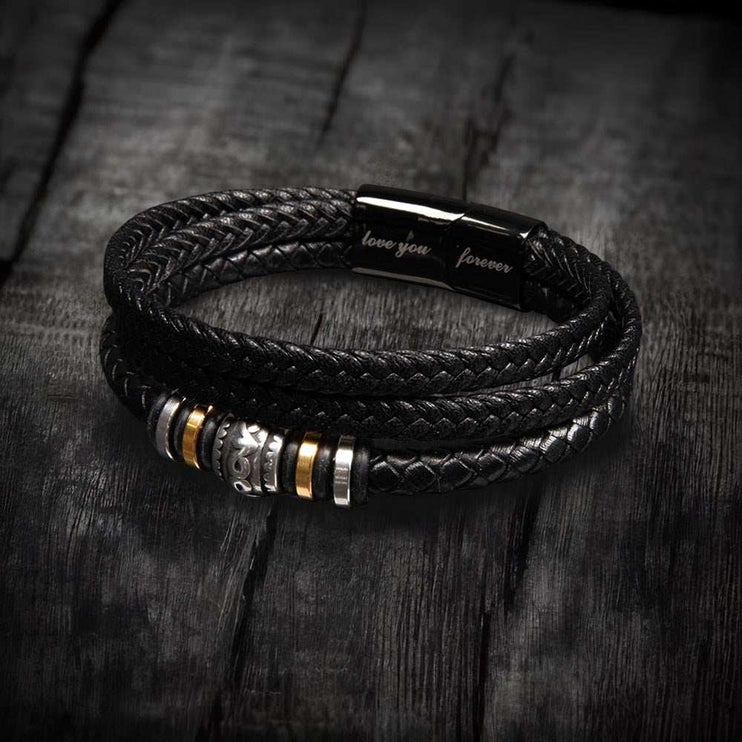 love you forever bracelet on top of a charcoal colored rock