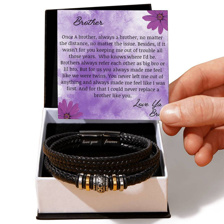 A men's love you forever bracelet in a two-tone box.